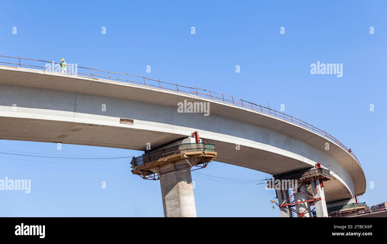 New Road Highway junction inter section entry exit ramp elevated  concrete moulded structure with distant civil engineer closeup section upward photog Stock Photo