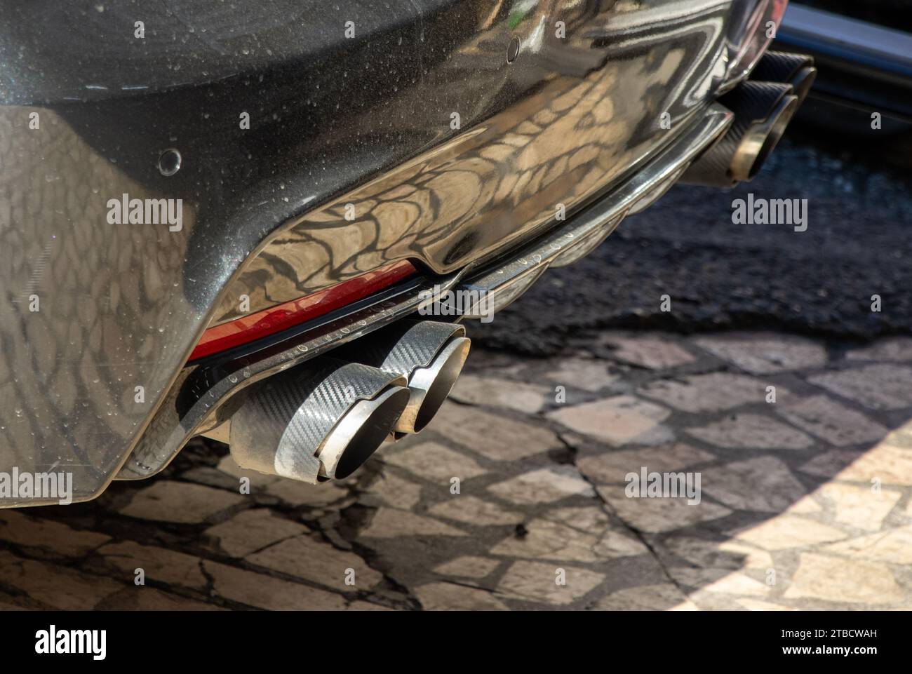 Sports car double exhaust black color close-up view Stock Photo