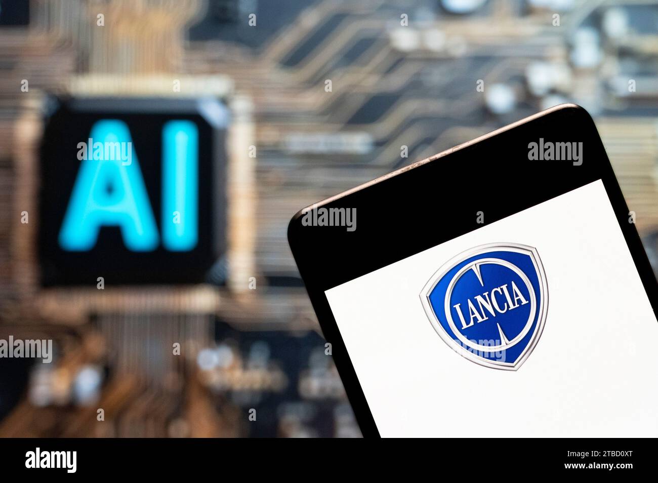 In this photo illustration, the Italian automobile manufacturer Lancia logo seen displayed on a smartphone with an Artificial intelligence (AI) chip and symbol in the background. Stock Photo
