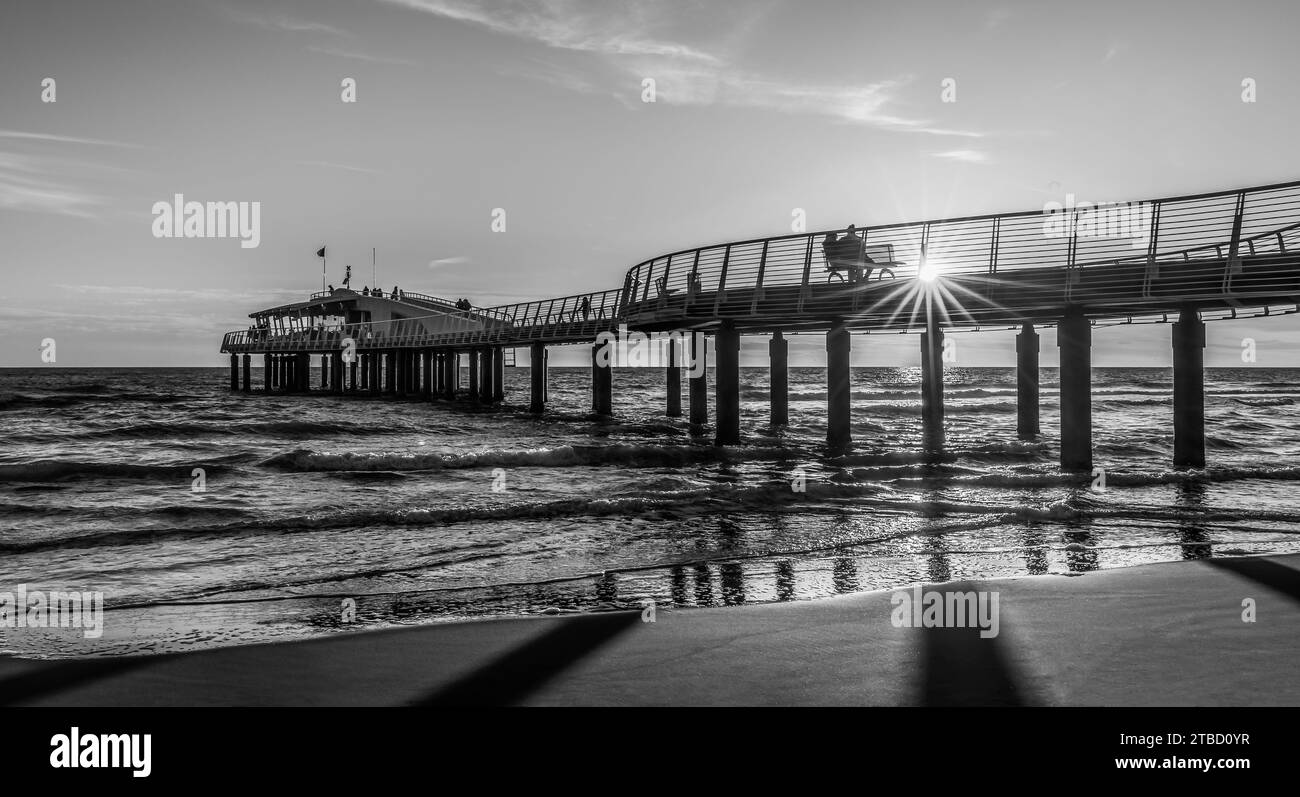 Sunset in black and white at the pier Stock Photo