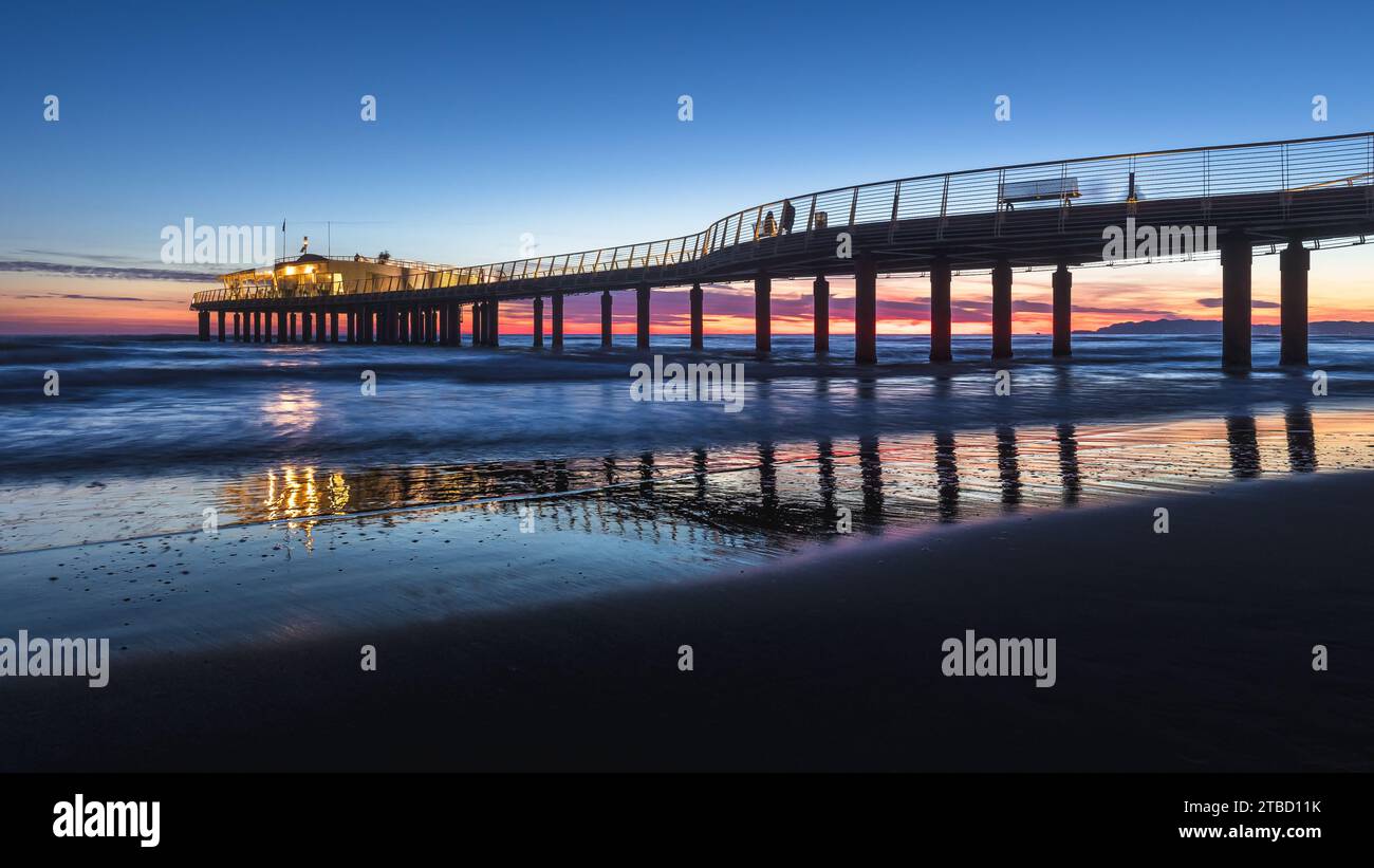 Enjoying a sunset at the pier Stock Photo