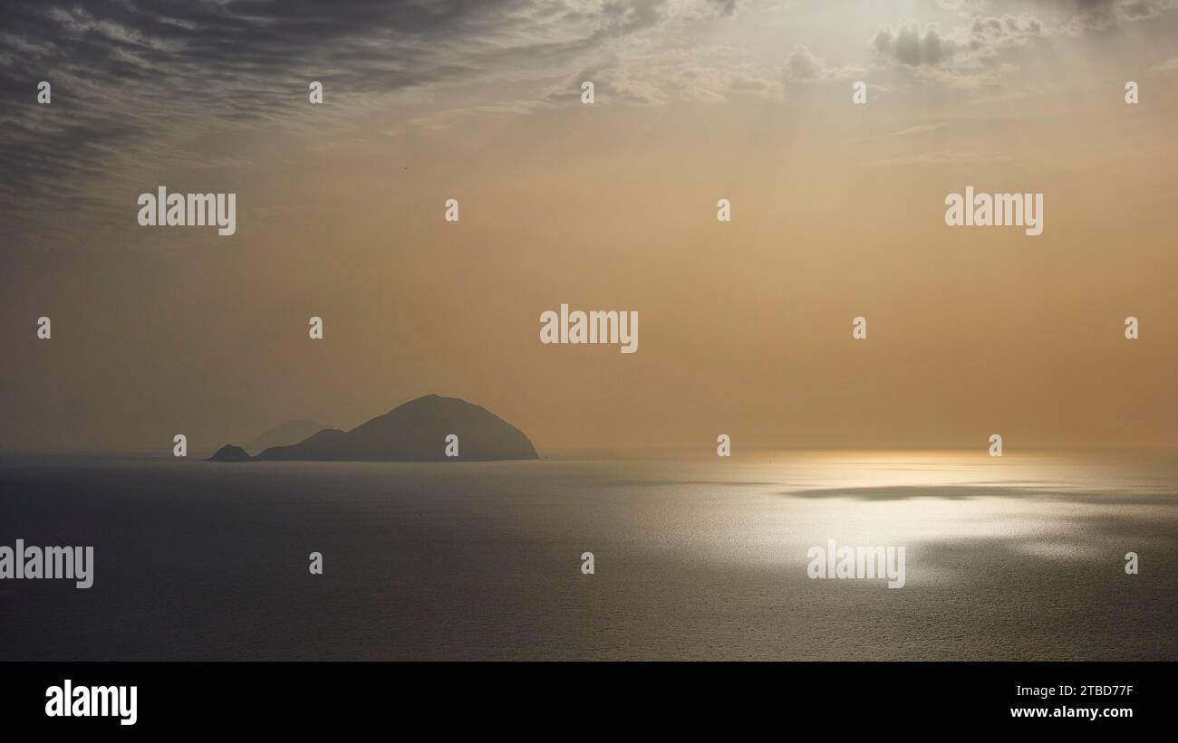 Santa Marina Salina, sunrise, sun rises behind Panarea, Salina, Aeolian Islands, Sicily, Italy Stock Photo