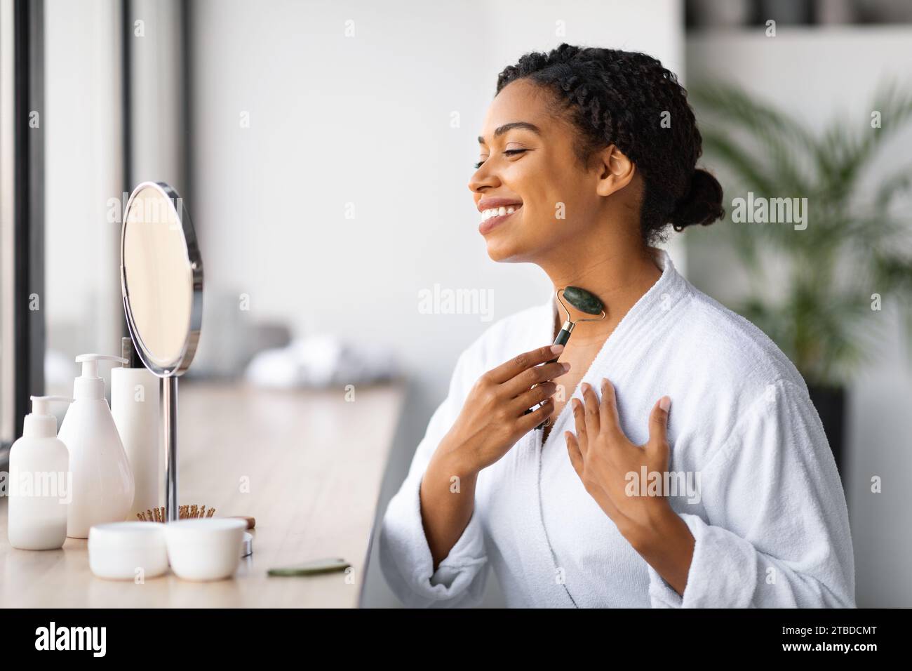 African female massaging face neck hi-res stock photography and images ...