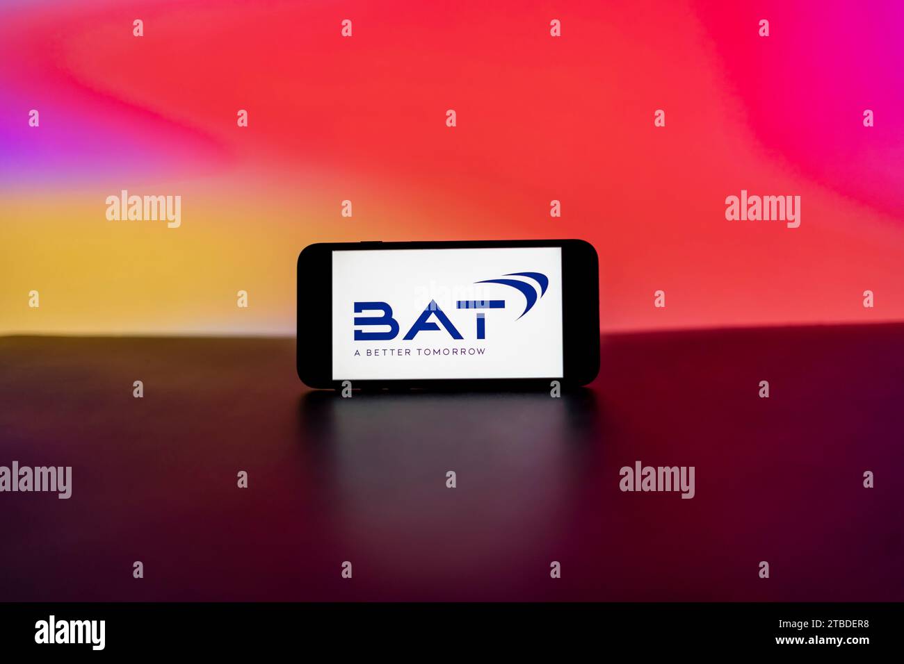 In this photo illustration, a BAT (British American tobacco) logo is seen displayed on a mobile phone screen. Stock Photo
