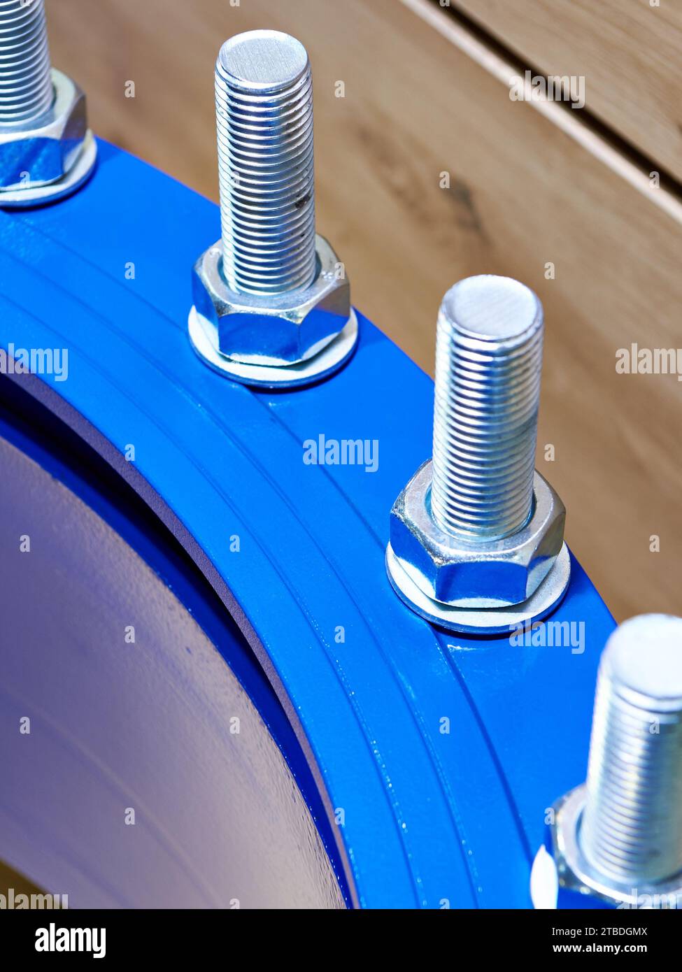 Bolts and nuts on the metal coupling of the water supply system Stock Photo
