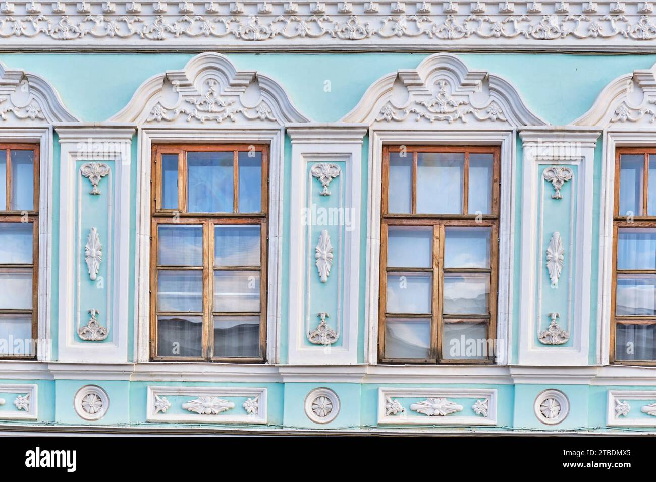 Close up windows of second floor, details of mansion of merchant Nikolaev in second half of 19th century, Yelabuga, Russia Stock Photo