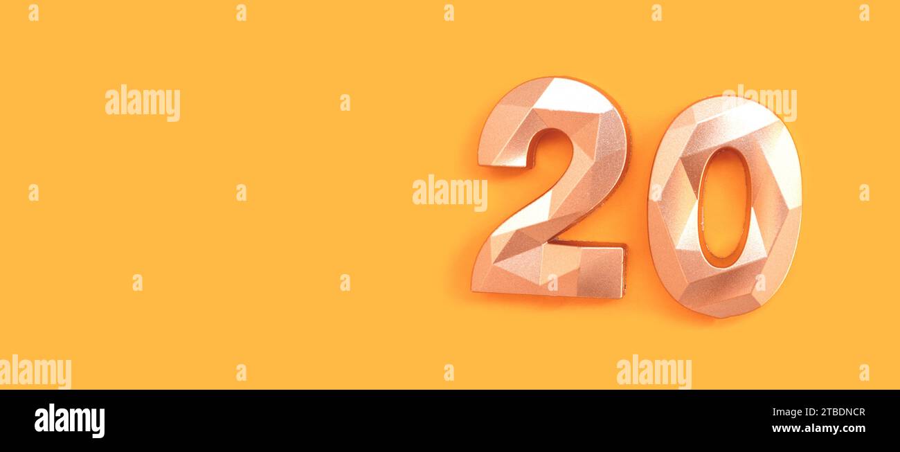 Banner with golden number 20 on a yellow background. Place for text. Stock Photo