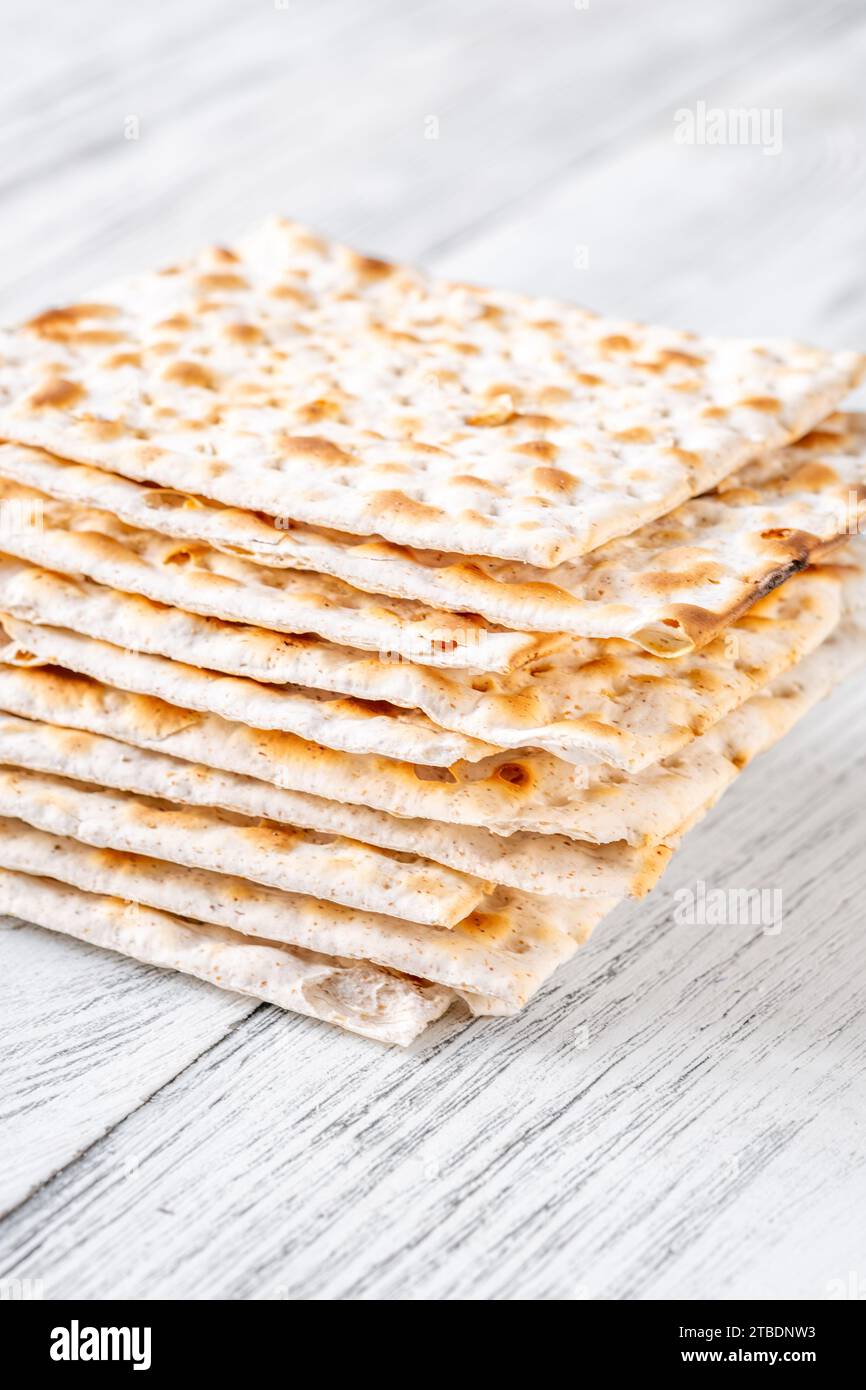 Stack of Matzah on the white wooden background Stock Photo