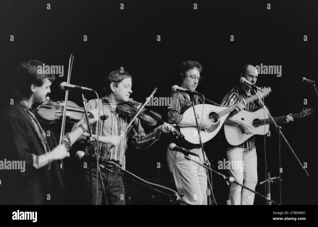 Whippersnapper the  British progressive folk group performing at the Merlin Theatre in Frome, Somerset in January 1987,  Chris Leslie, Dave Swarbrick, Stock Photo