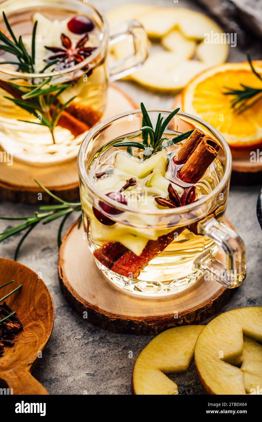 Delicious white mulled wine with apples, cranberries and spices Stock Photo
