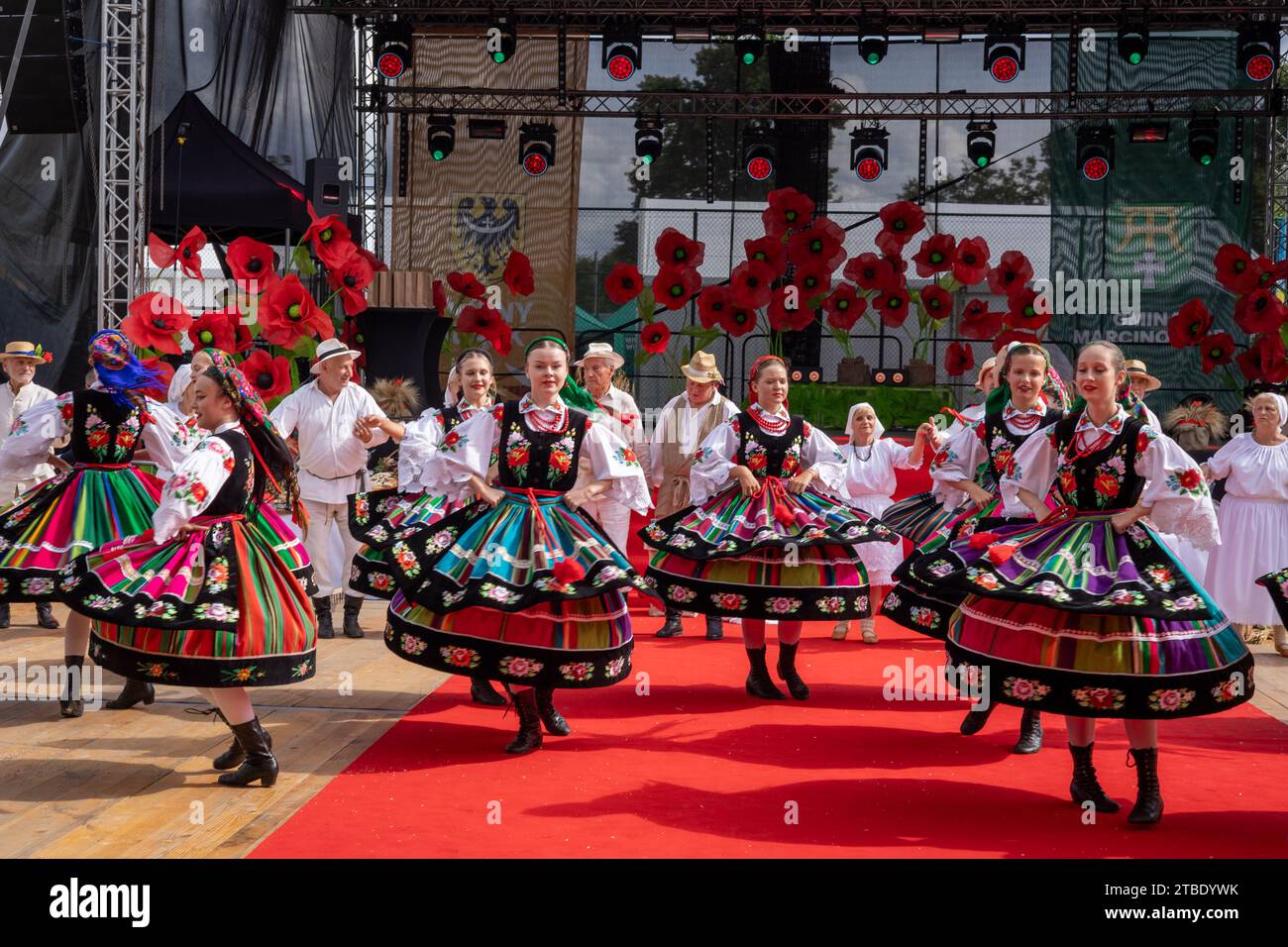 Szczepanow, Poland - September 02, 2023: Traditional Polish folklore dance group performance on stage at voivodeship harvest festival. Stock Photo