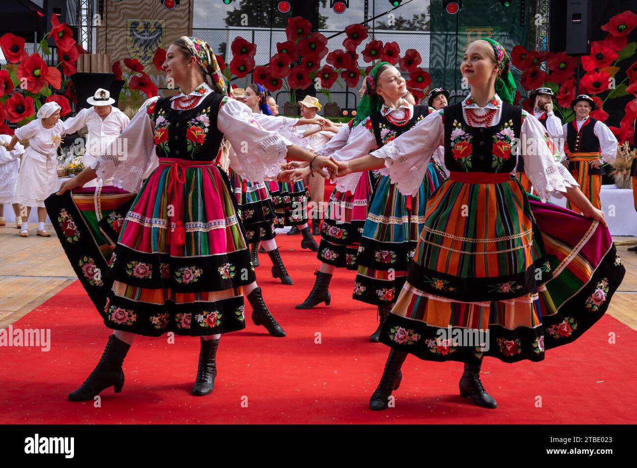 Szczepanow, Poland - September 02, 2023: Traditional Polish folklore dance group performance on stage at voivodeship harvest festival. Stock Photo