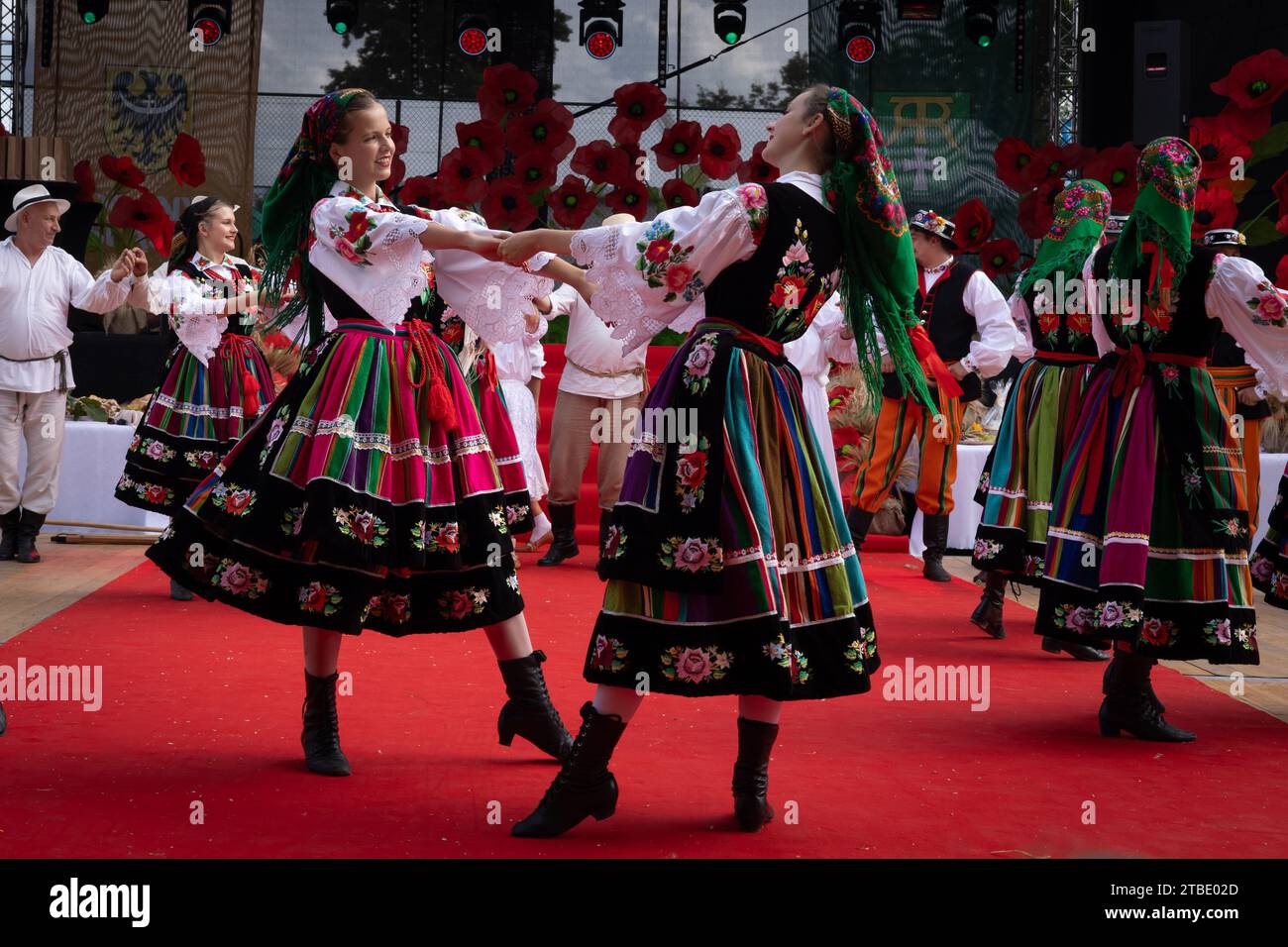 Szczepanow, Poland - September 02, 2023: Traditional Polish folklore dance group performance on stage at voivodeship harvest festival. Stock Photo