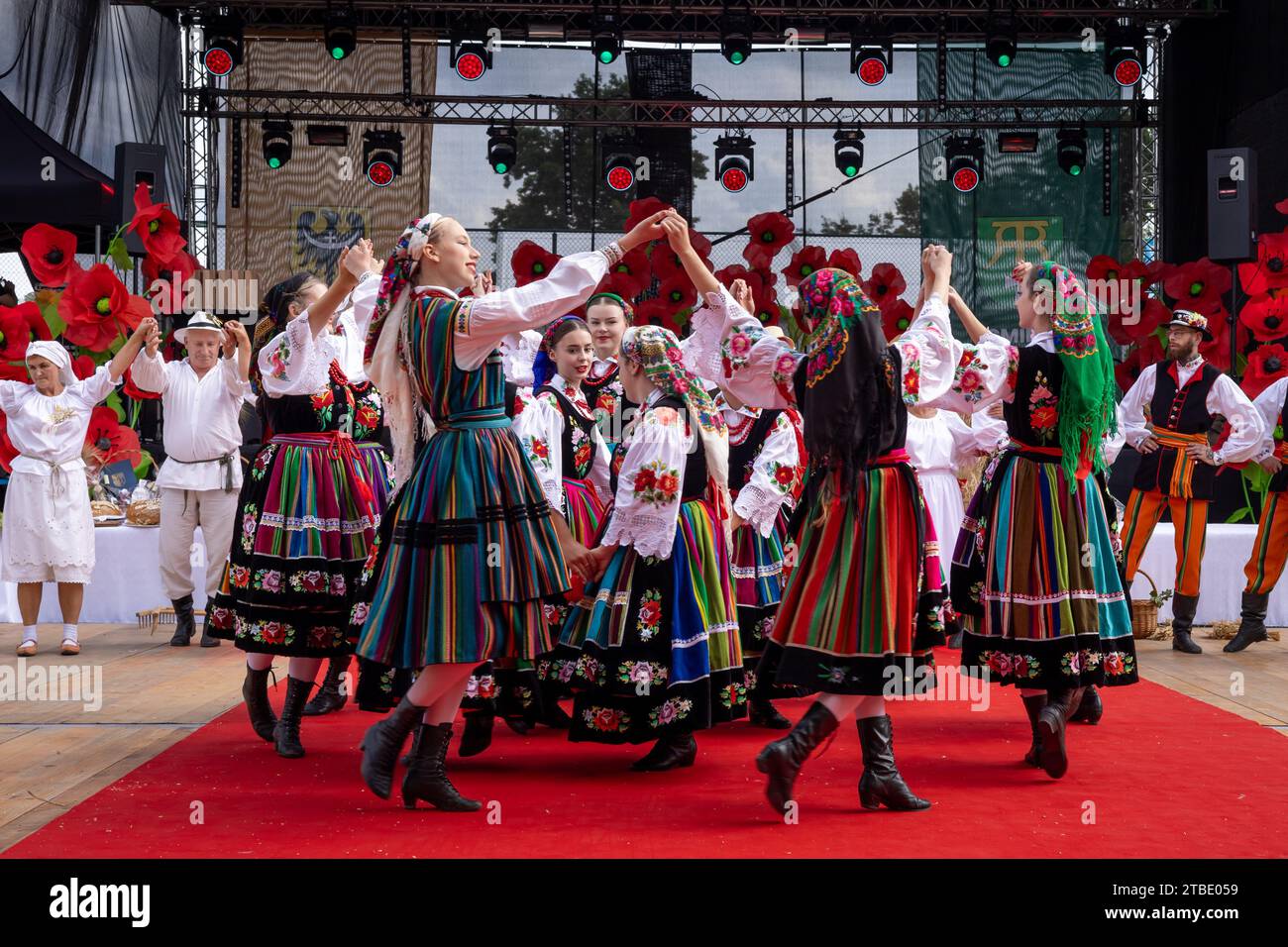 Szczepanow, Poland - September 02, 2023: Traditional Polish folklore dance group performance on stage at voivodeship harvest festival. Stock Photo