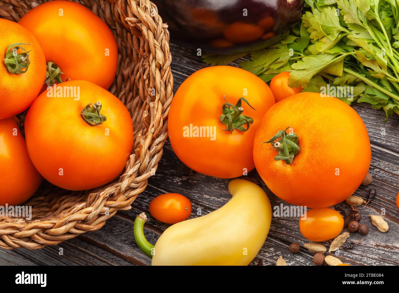 orange tomato on wood background Stock Photo