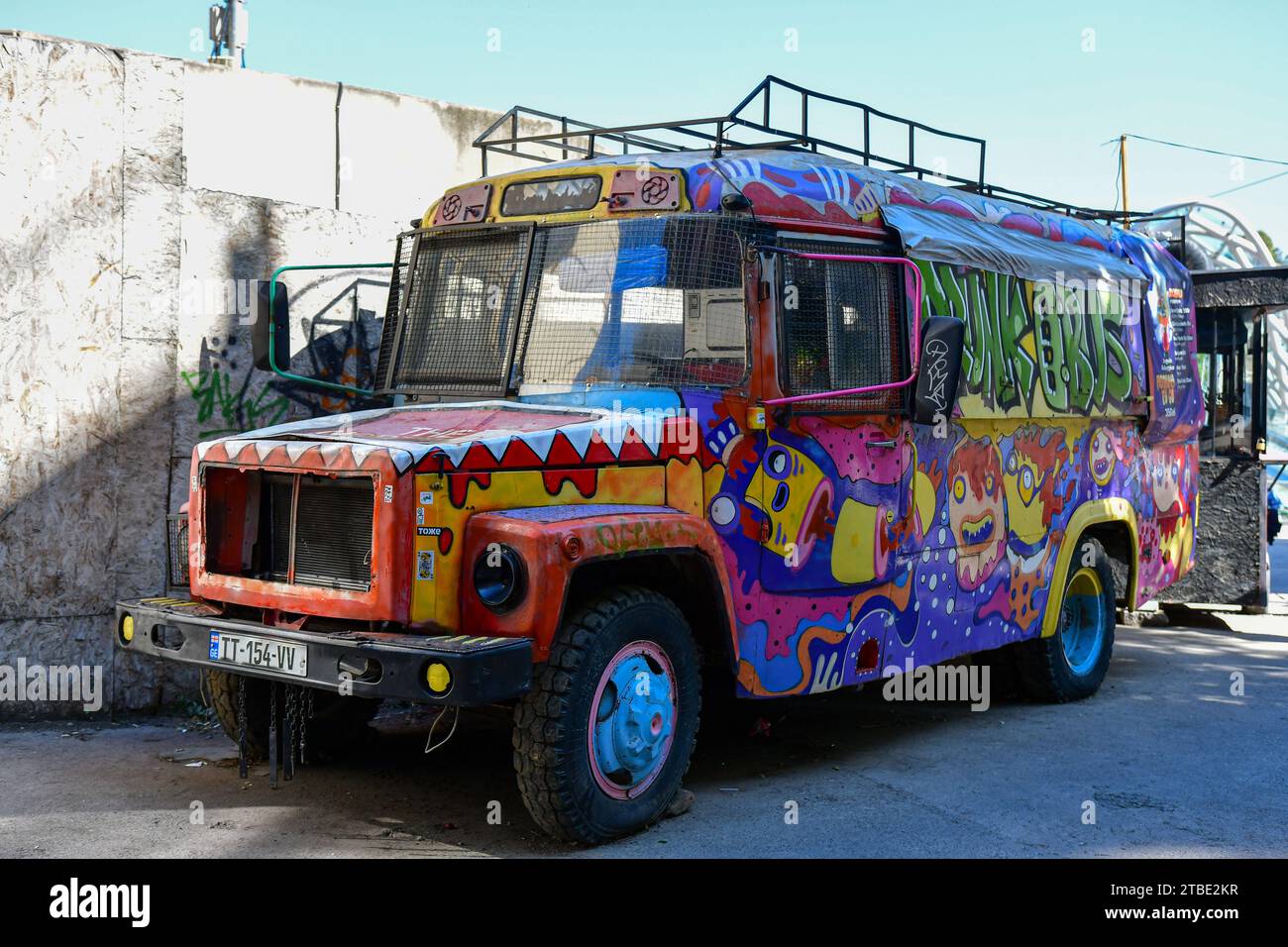 Tbilisi, Georgia - October 8, 2023: A graffiti-painted mobile cafe 'drunk bus' in Tbilisi Old Town Stock Photo