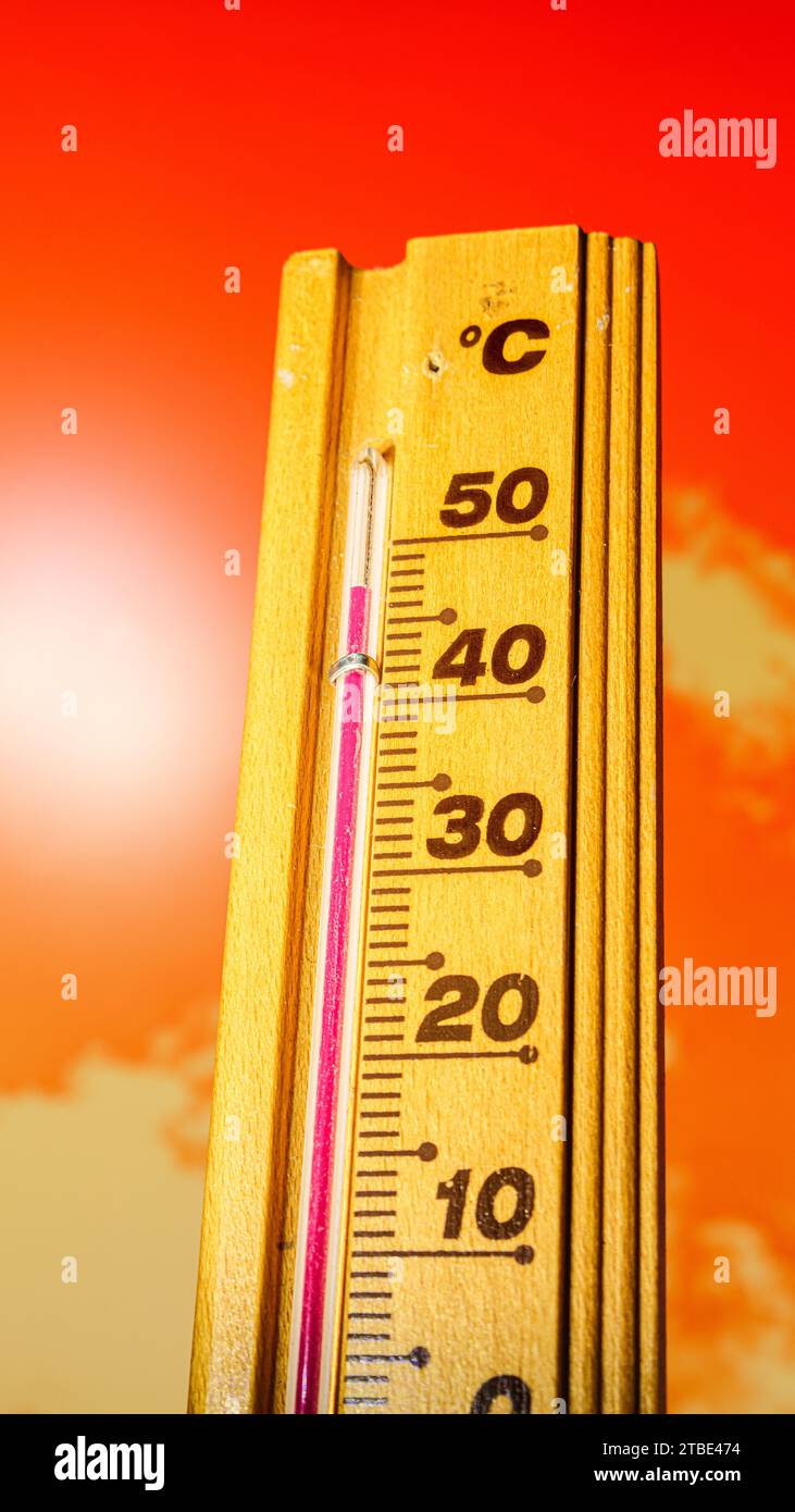 The thermometer displays a high heatwave temperature of 47 degrees Celsius. Extreme weather, Global climate change, Earth, Hot summer season Stock Photo