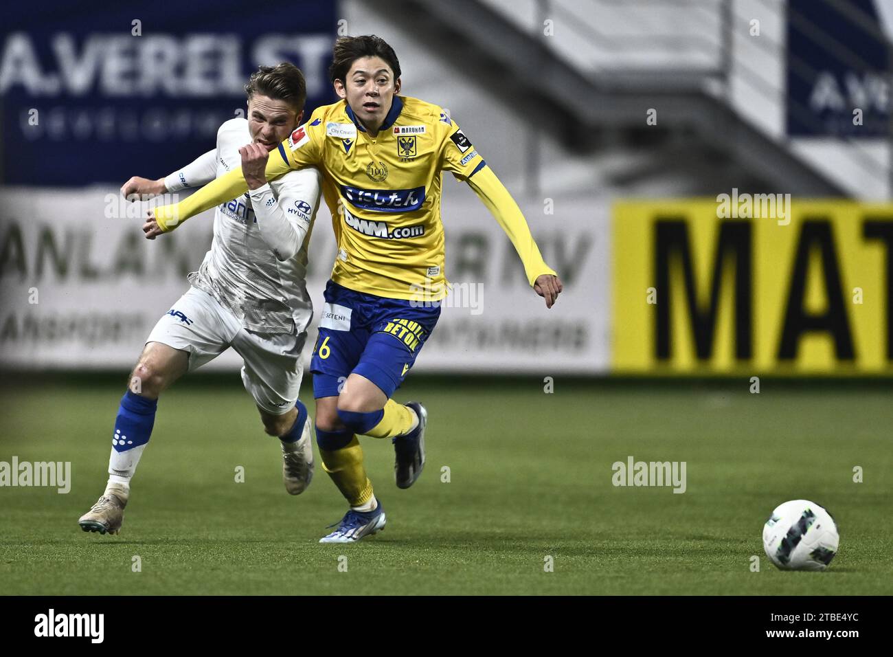 Sint Truiden, Belgium. 06th Dec, 2023. Gent's Matisse Samoise and STVV's Rihito Yamamoto fight for the ball during a Croky Cup 1/8 final match between Sint-Truidense VV and KAA Gent, in Sint-Truiden, Wednesday 06 December 2023. BELGA PHOTO JOHAN EYCKENS Credit: Belga News Agency/Alamy Live News Stock Photo