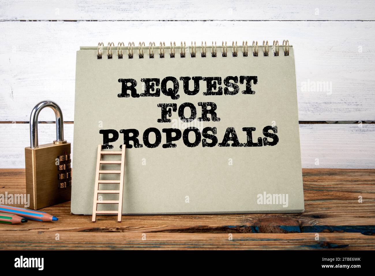 Request for proposals. Green notepad on wooden texture table and white ...