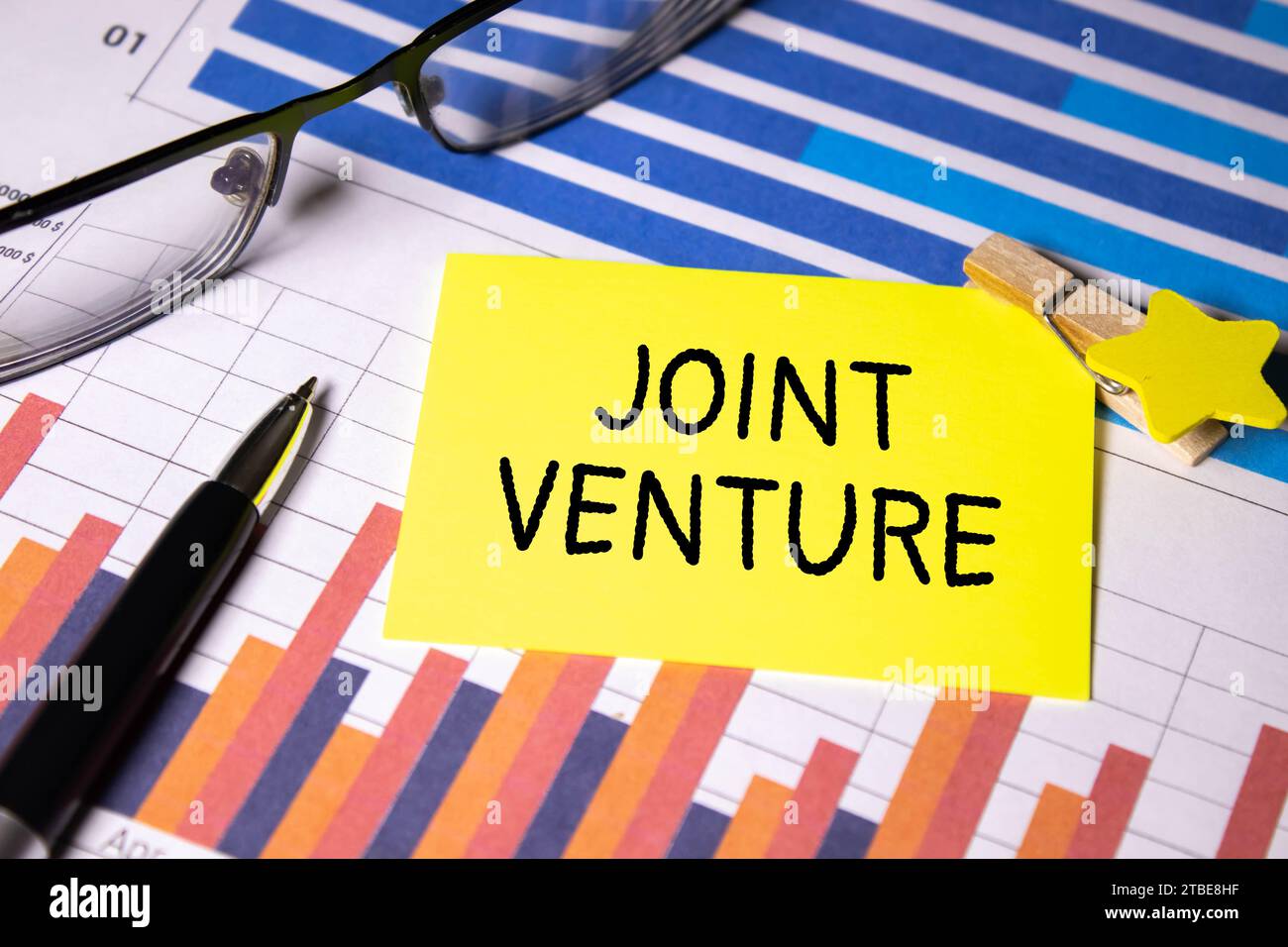 Text JOINT VENTURE text on sticky on keyboard, business concept. Stock Photo