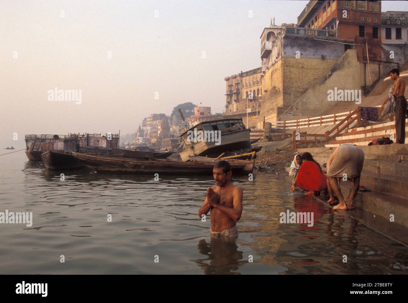 Group of people performing their morning ablutions, Ganges River, Varanasi, Uttar Pradesh, India Stock Photo