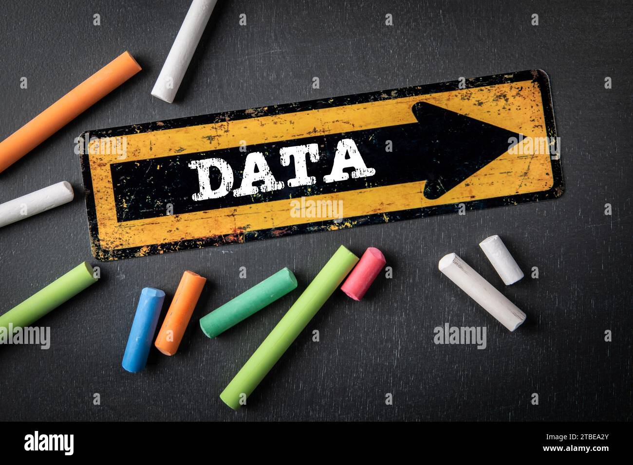 DATA Concept. Direction arrow with text on a dark chalkboard background. Stock Photo