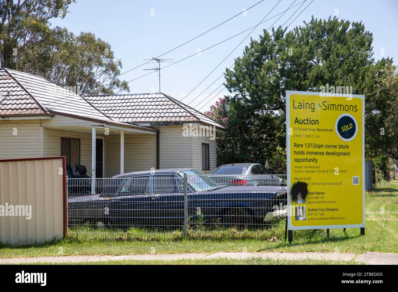 Bungalow house in Mt Druitt in Western Sydney sold at auction, cars in