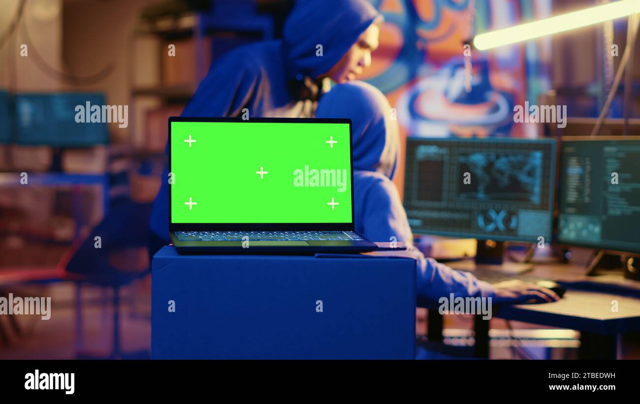 Green screen laptop in bunker with graffiti walls left behind by