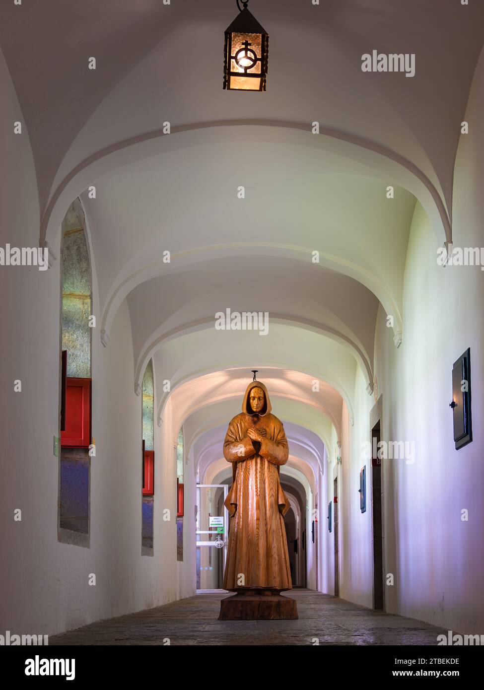 Grande Chartreuse, France - September 30, 2023: Corridor of the Grande Chartreuse Carthusian Museum with a sculpture of Saint Bruno, the founder of th Stock Photo