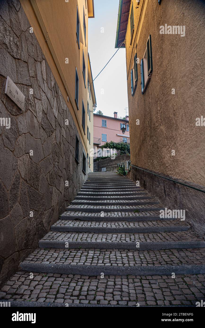 Cobblestone steps between buildings in the city of Varenna, Italy Stock Photo