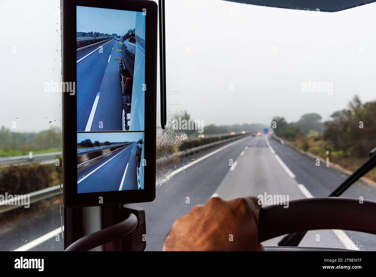 Rearview mirror with cameras in a truck, screen inside the vehicle where the driver can see the back of the trailer. Stock Photo