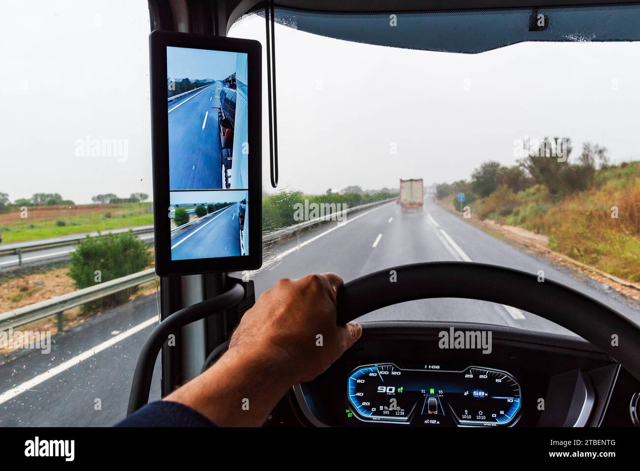 Rearview mirror with cameras in a truck, screen inside the vehicle where the driver can see the back of the trailer. Stock Photo