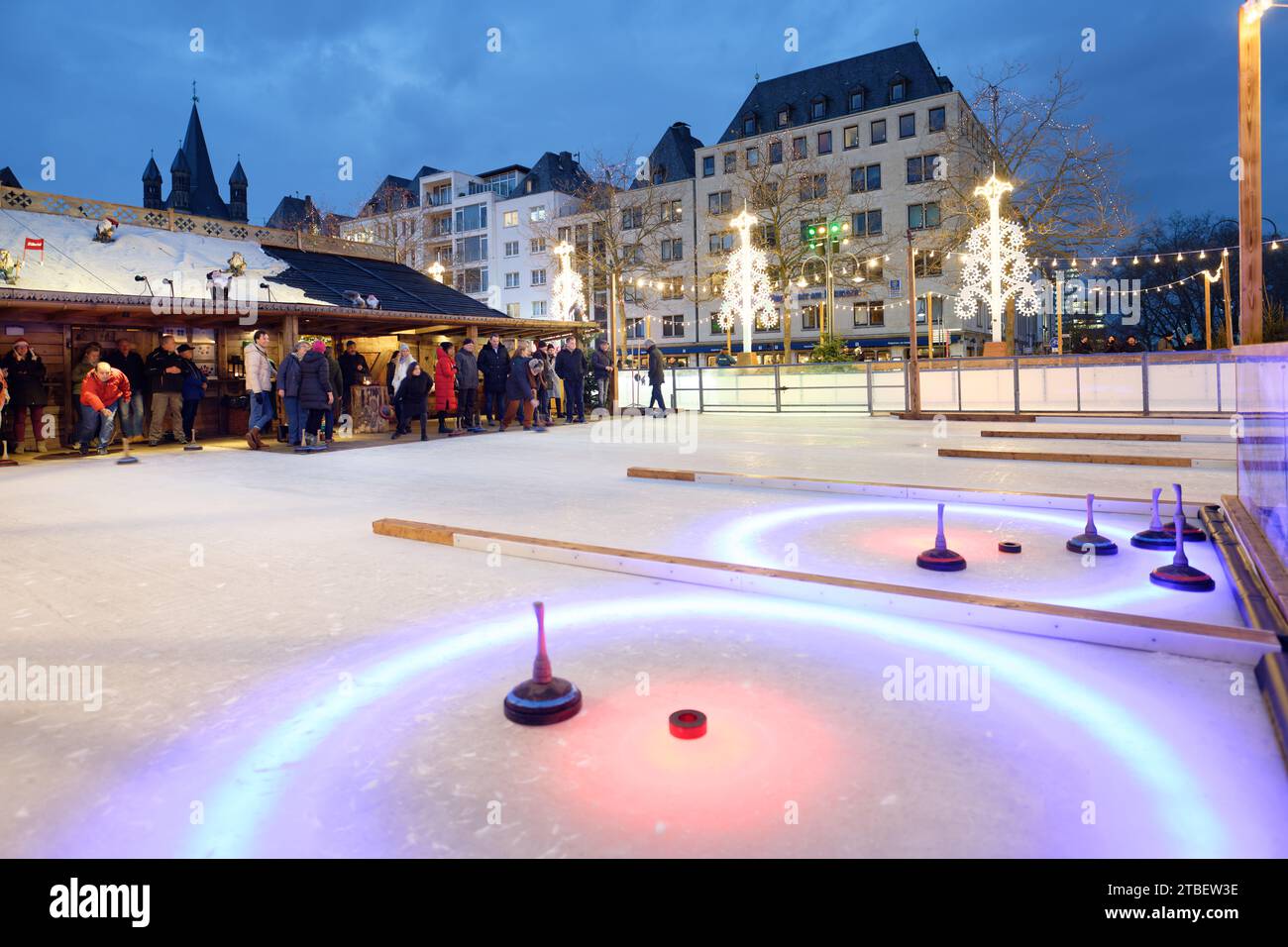 Cologne, Germany December 06 2023: Curling at the christmas market Heinzel's winter fairytale in the old town of cologne Stock Photo