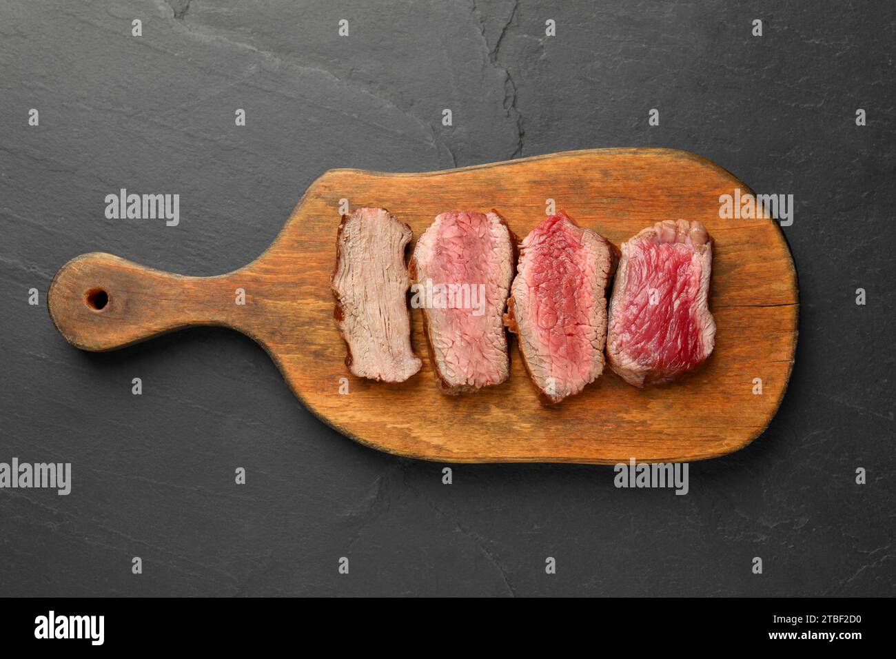 Delicious sliced beef tenderloin with different degrees of doneness on