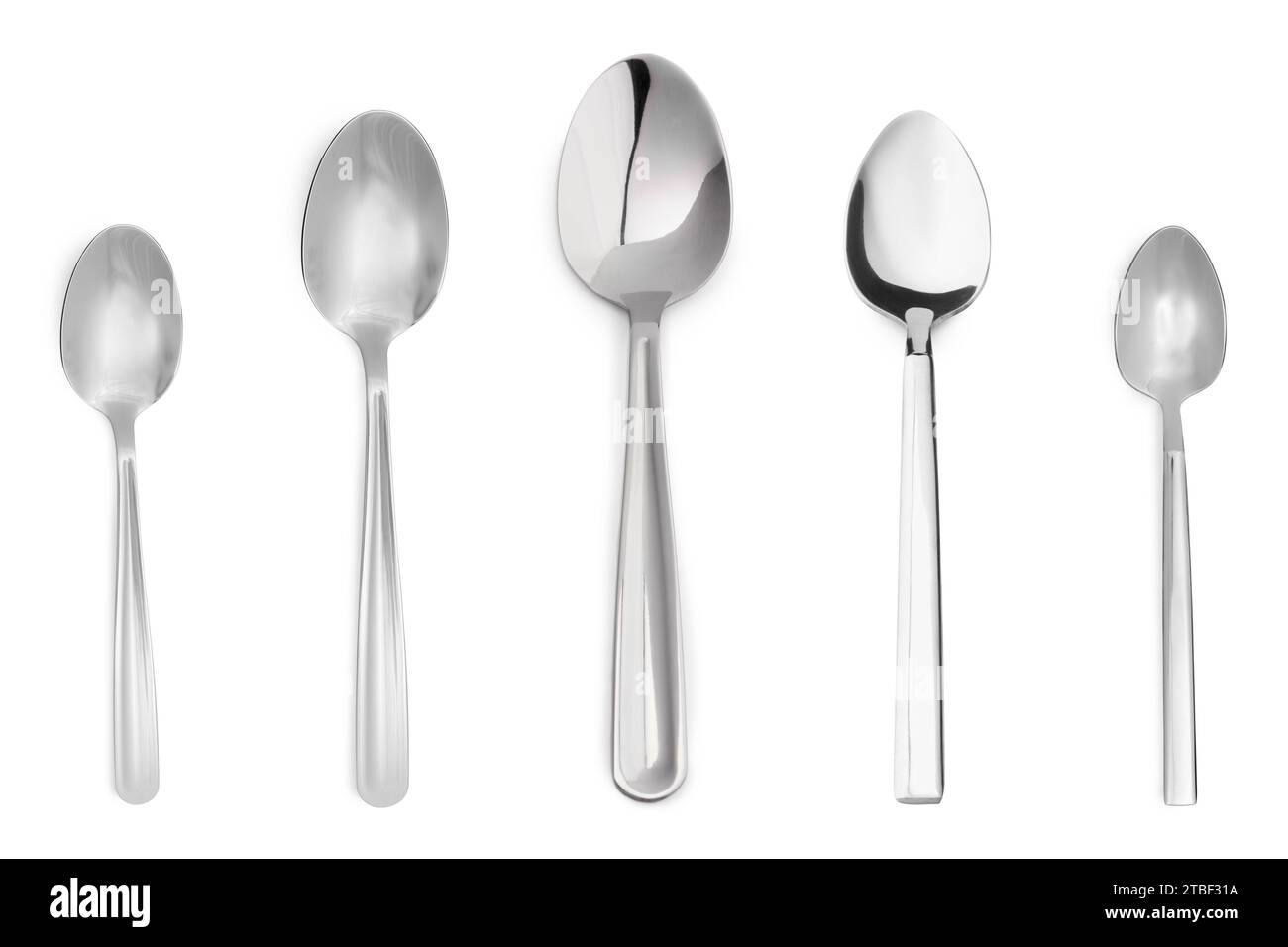 Different stylish silver spoons on white background Stock Photo