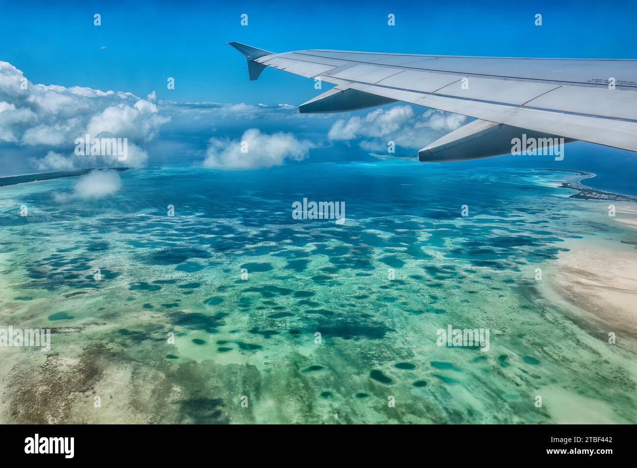 Aerial view of the coral reef in the Indian Ocean during approach to