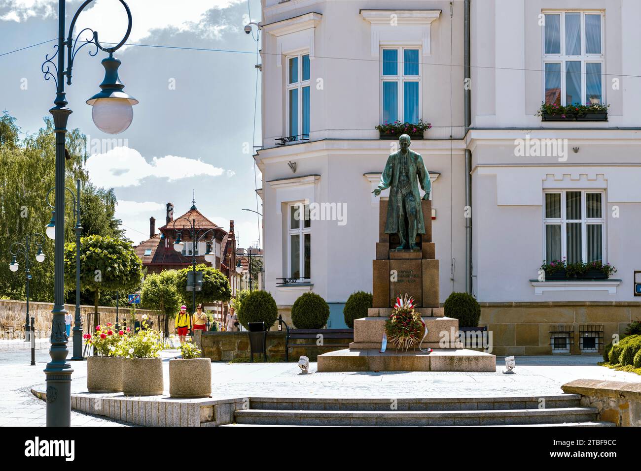 The bronze monument to Ignacy Lukasiewicz on a pedestal made of Volyn granite is located on the square in front of the Town Hall. Krosno, Poland. Stock Photo