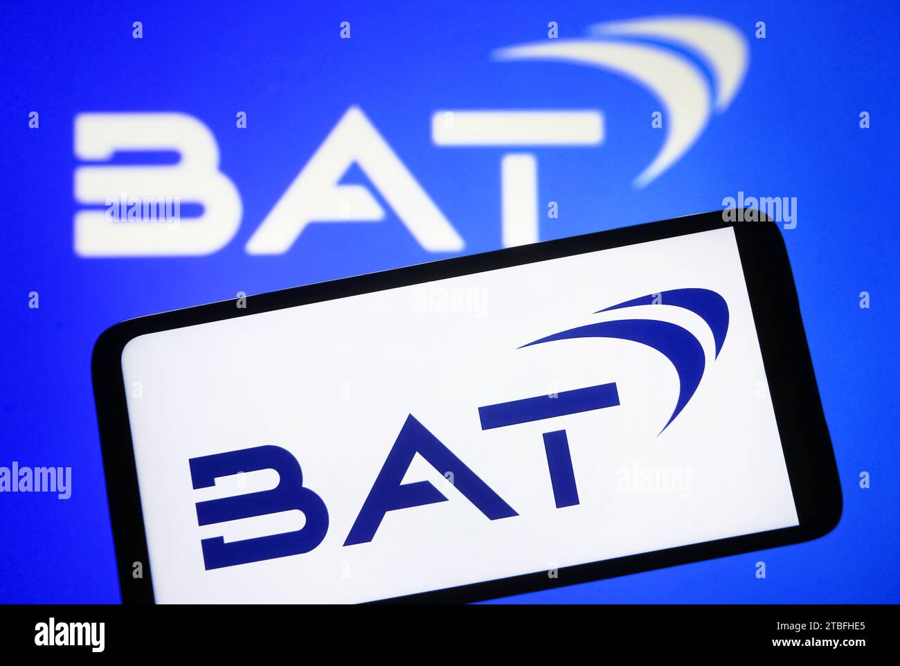 Ukraine. 06th Dec, 2023. In this photo illustration, British American Tobacco plc (BAT)logo is seen on a smartphone and on a pc screen. (Photo by Pavlo Gonchar/SOPA Images/Sipa USA) *** Strictly for editorial news purposes only *** Credit: Sipa USA/Alamy Live News Stock Photo