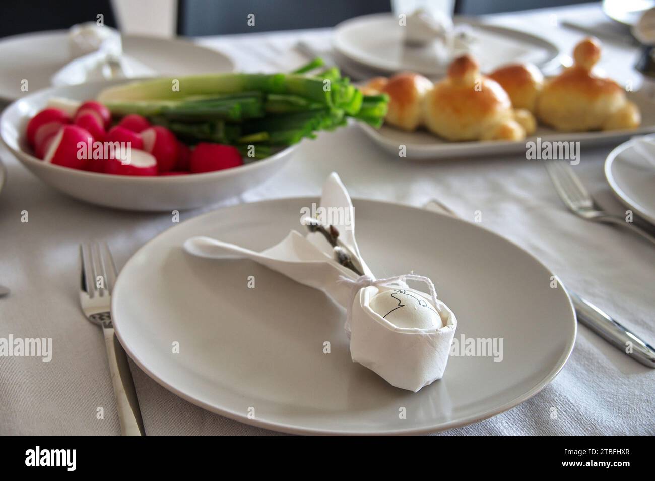 Decorated table served for Easter dinner Stock Photo