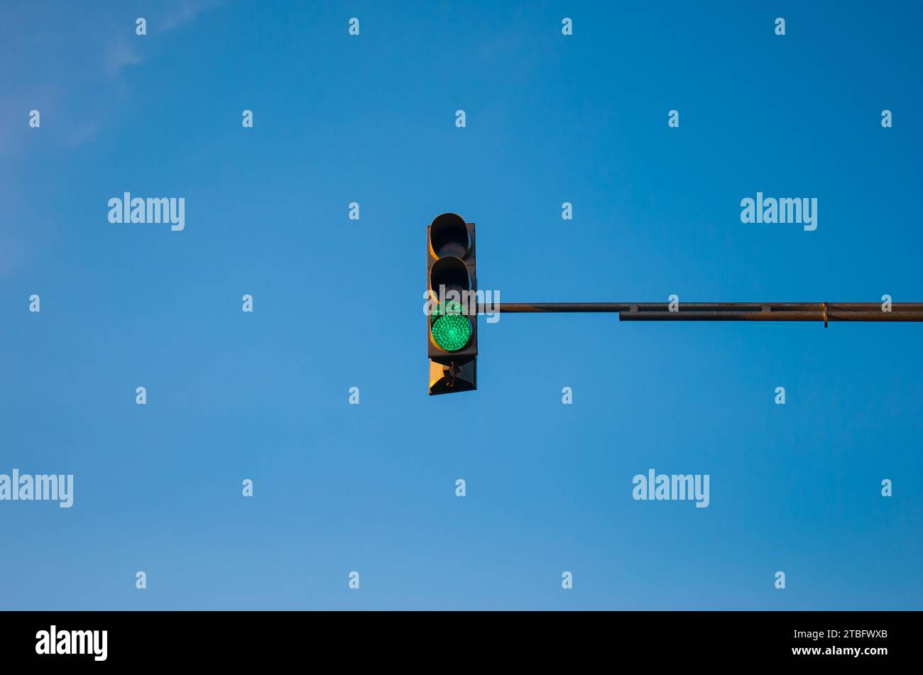 Traffic light showing red with blue sky background Stock Photo - Alamy