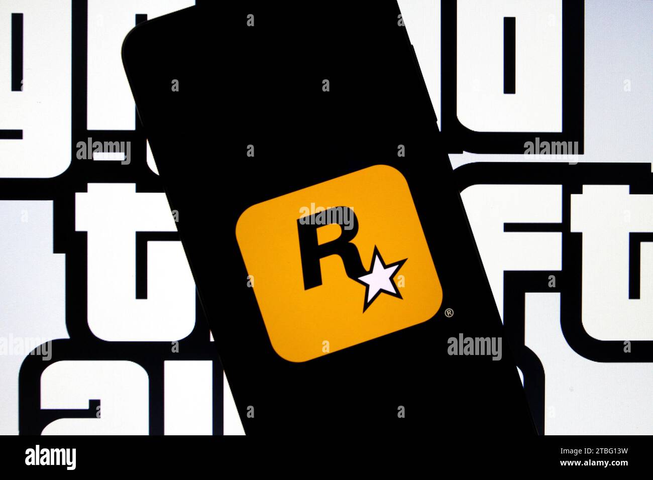 Sleman, Yogyakarta, Indonesia. 7th Dec, 2023. In this photo illustration, the logo of the American video game publisher based in New York City, Rockstar Games and logo of the Grand Theft Auto (GTA) can be seen on a smartphone screen. Rockstar Games officially released a trailer for the game Grand Theft Auto VI (GTA VI), the latest in the iconic game series since the 2000s, which is planned to be released in 2025. (Credit Image: © Angga Budhiyanto/ZUMA Press Wire) EDITORIAL USAGE ONLY! Not for Commercial USAGE! Stock Photo