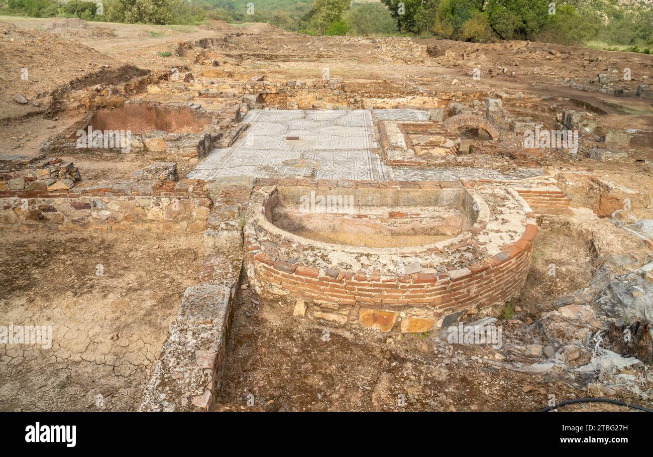 Exterior archaeological remains of the floors of different Roman rooms with the floor decorated with mosaics with geometric figures in the Mitreo hous Stock Photo
