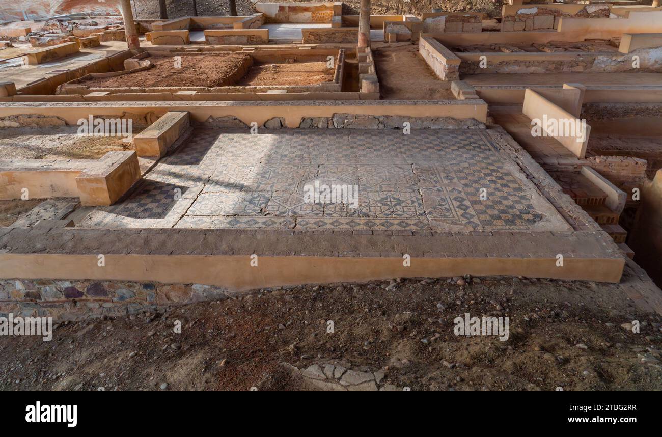 Archaeological remains of the floor and floors of different Roman rooms with the floor decorated with mosaics with geometric figures from the Mitreo h Stock Photo