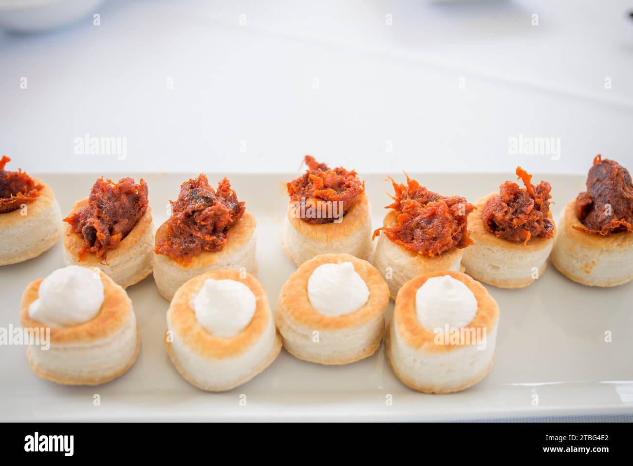 Puff pastry canapes with red Iberian chorizo and Torta del Casar cheese