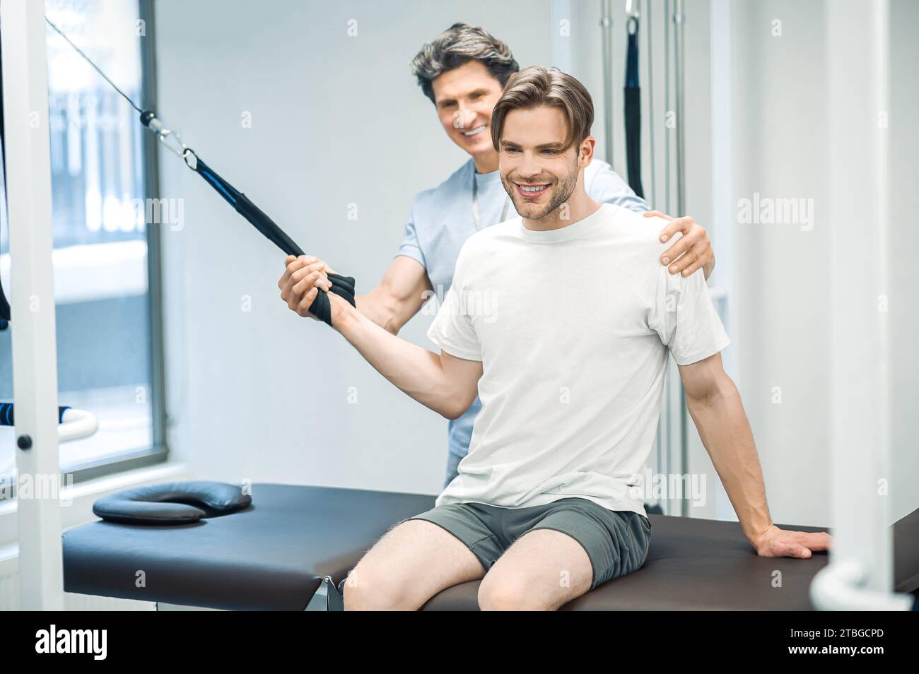 Arm hyperextension. ale young patient having a session of arm