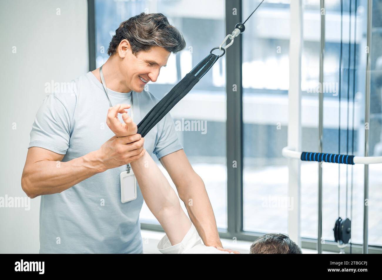 Arm hyperextension. ale young patient having a session of arm