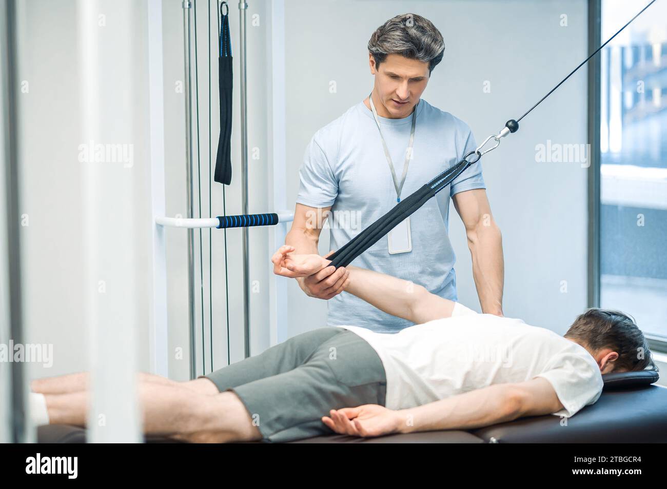 Arm hyperextension. ale young patient having a session of arm