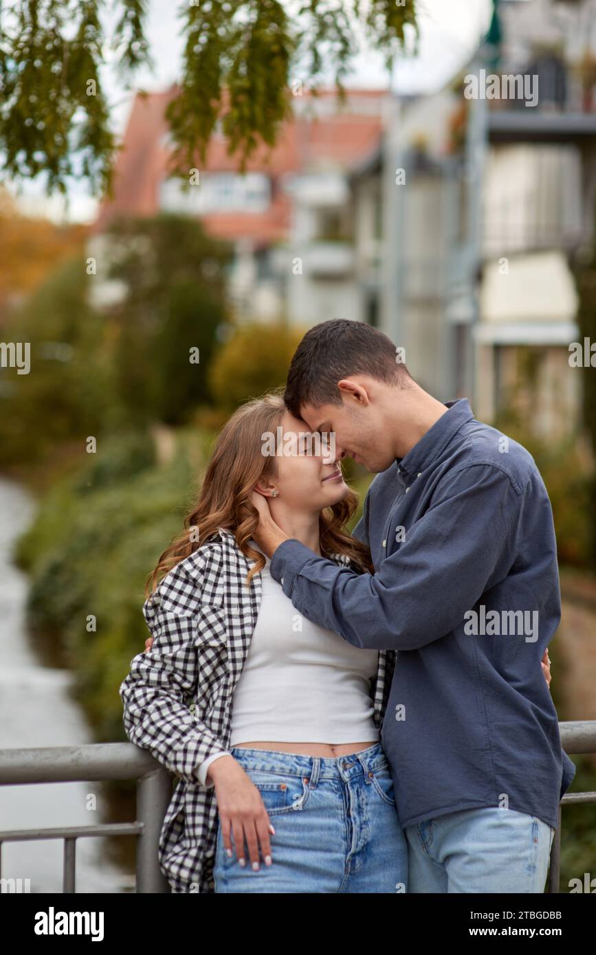 Teenage couple in love cuddling hi-res stock photography and images - Alamy