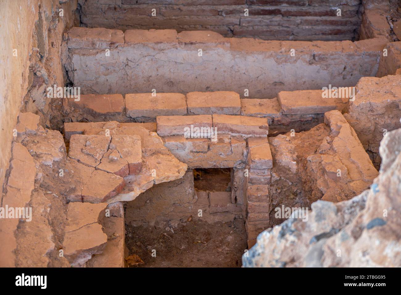 Ancient Roman ruins eroded from rooms and hallway walls of the Merida Casa Mithraeum archaeological complex in Merida, Spain. Stock Photo