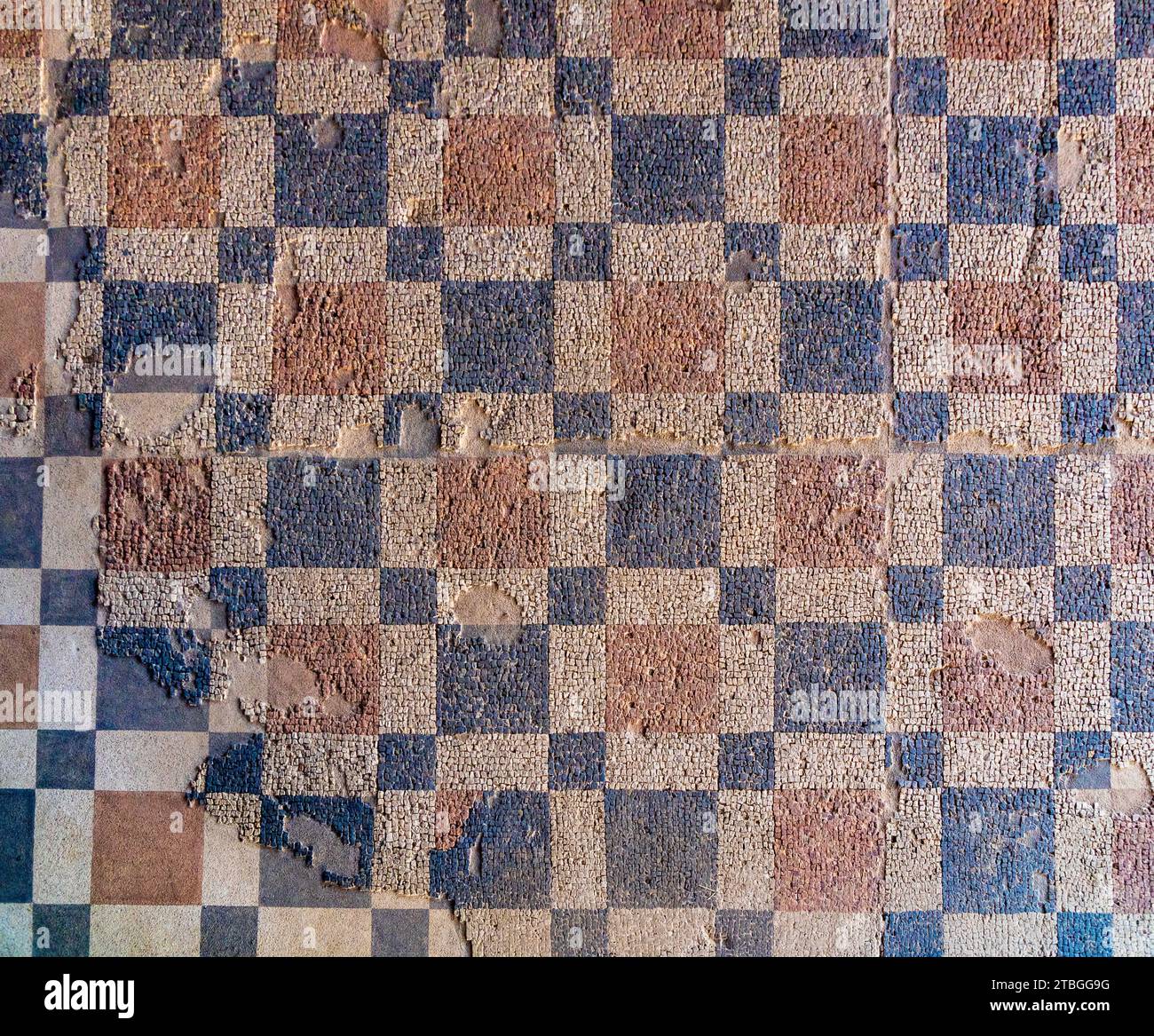Archaeological remains of Roman mosaic with geometric figures, red and ...